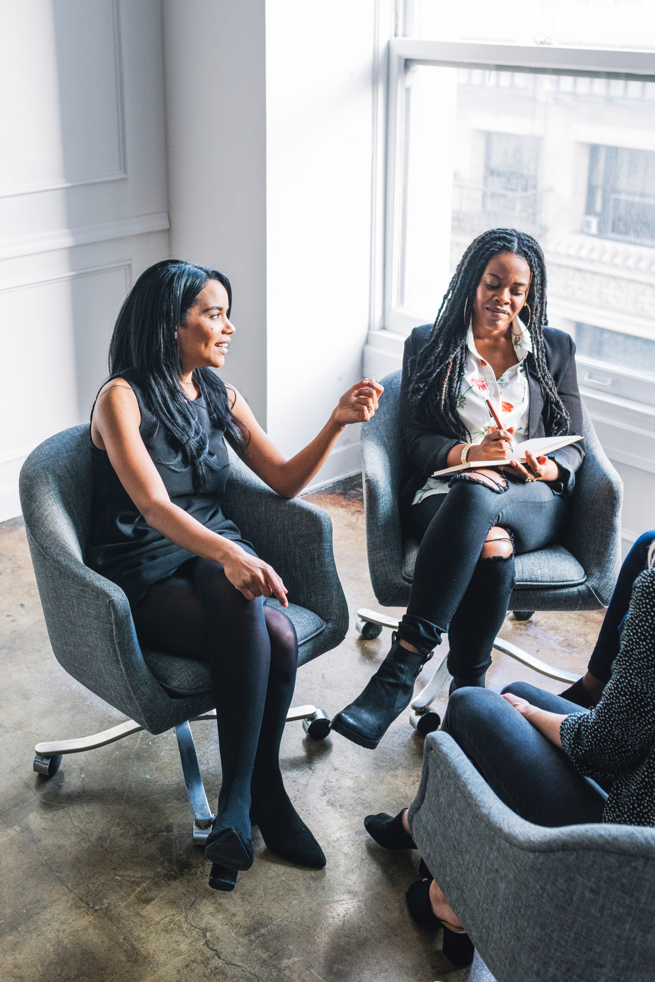 Black leaders in warm, intimate conversation